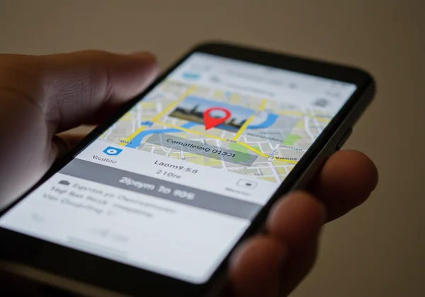 Viewing photo location metadata on a smartphone screen.